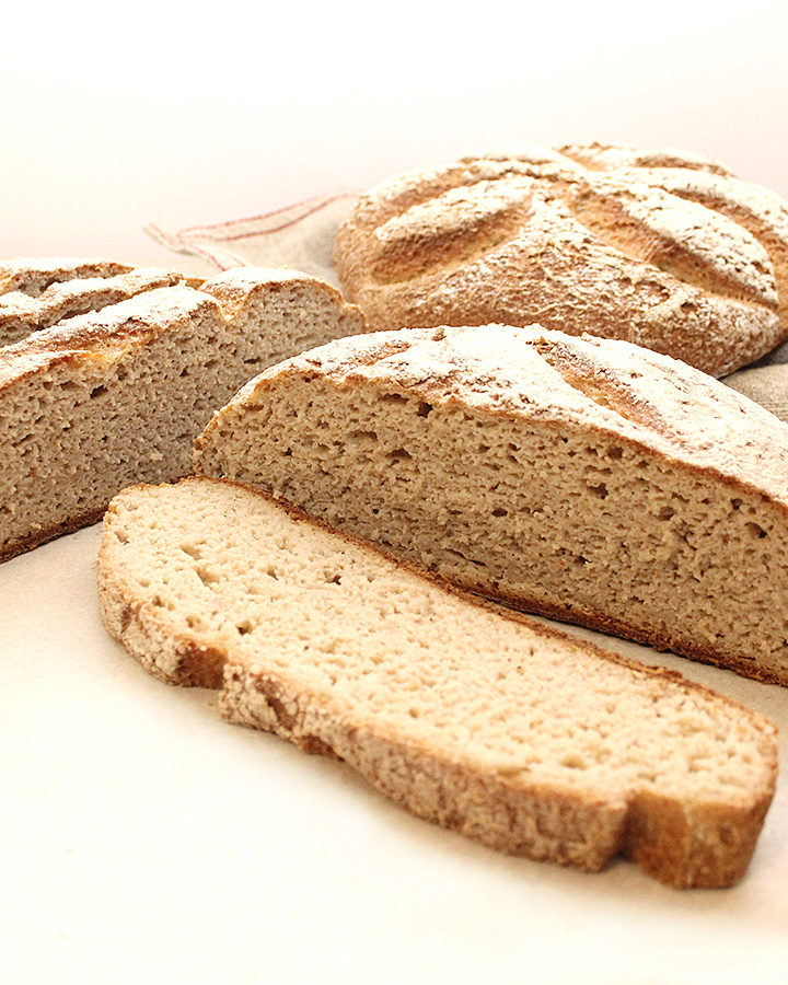 A picture of a beautiful crusty artisan-style free-form Buckwheat Sourdough Loaf Gluten-Free Vegan. Allergen-Friendly. freshisreal.com