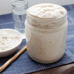 Bubbly wild yeast in a glass jar ready to be used in a gluten-free sourdough loaf. freshisreal.com