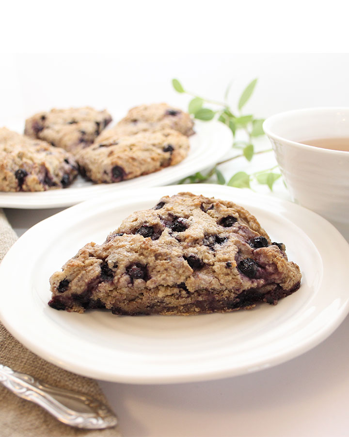 Beautiful Gluten-Free Vegan Blueberry Scones. Prepared without gluten, eggs, or dairy. Easy-to-make and delicious! For recipes visit freshisreal.com