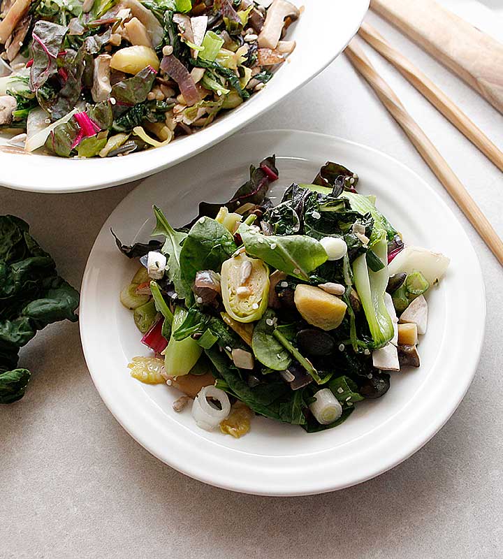 A delicious Warm Winter Salad prepared with fresh greens, bok choy and mushrooms that can be ready in less than 40 minutes! Visit freshisreal.com for the recipe!