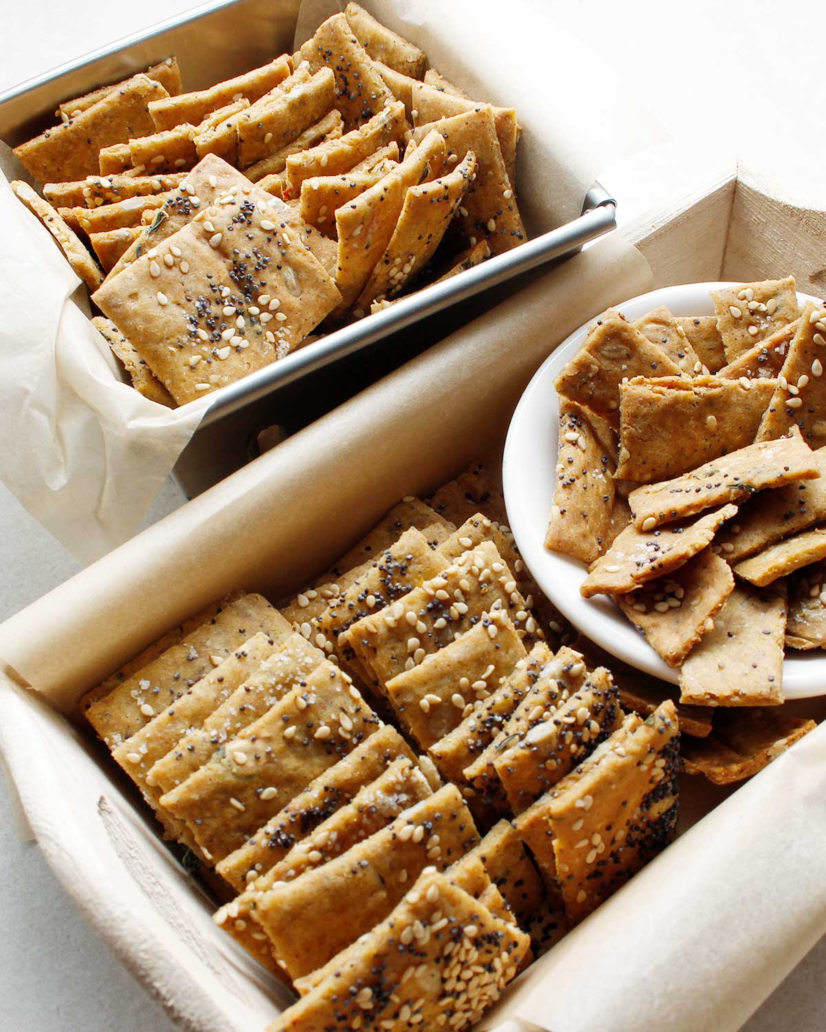 Homemade seed crackers in two small baskets.