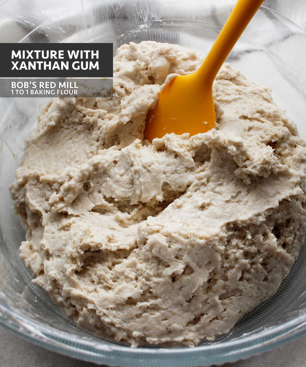 Yeast-free, gluten-free, vegan dough mixture prepared with Bob's Red Mill 1 to 1 Baking Flour that contains xanthan gum.