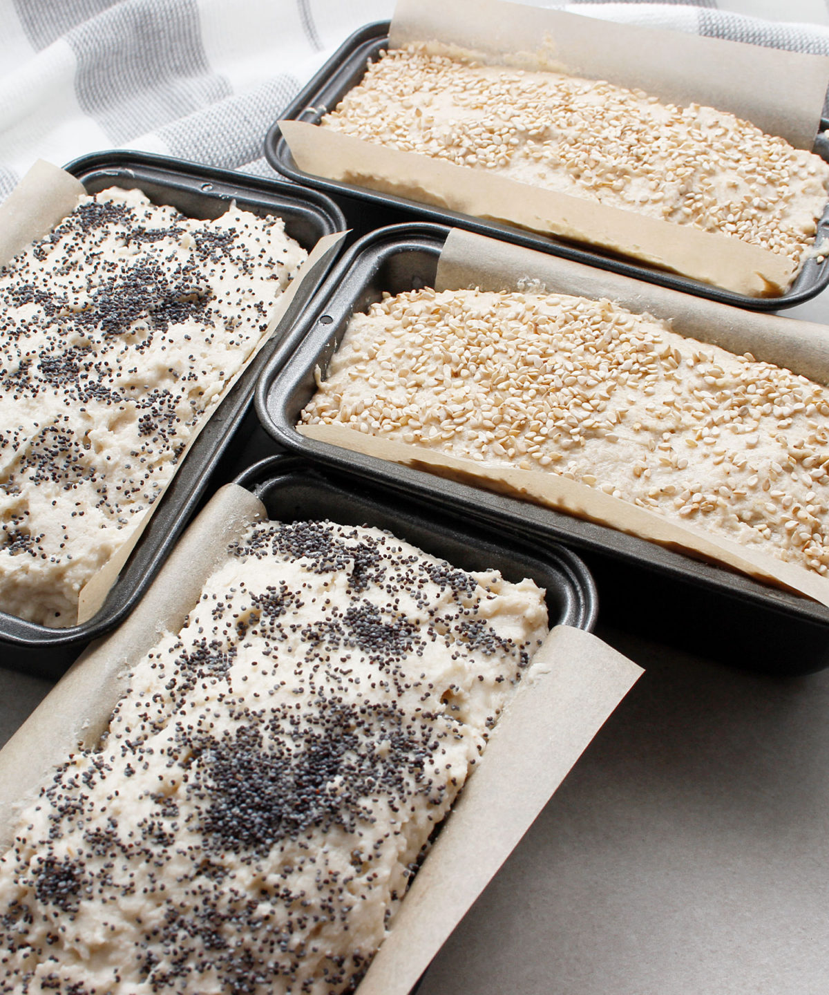 Yeast-free, gluten-free, vegan dough in mini bread pans ready to bake.