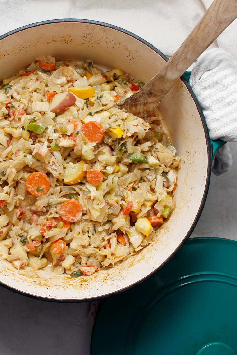 Large Dutch oven with beautiful vegetable medley with vegan cream sauce.