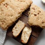 Irish Soda Bread without gluten served on a dark wood board.